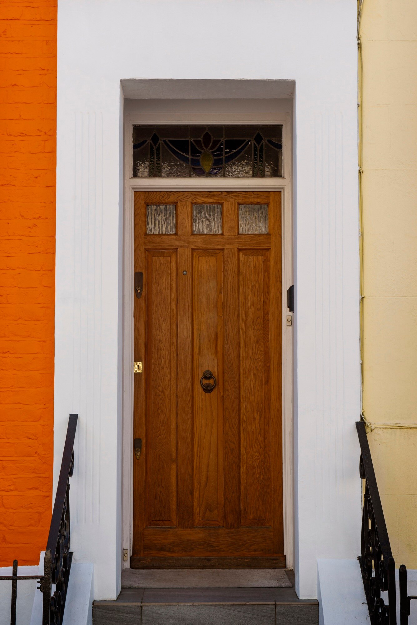 front-view-front-door-with-orange-wall_23-2149360643